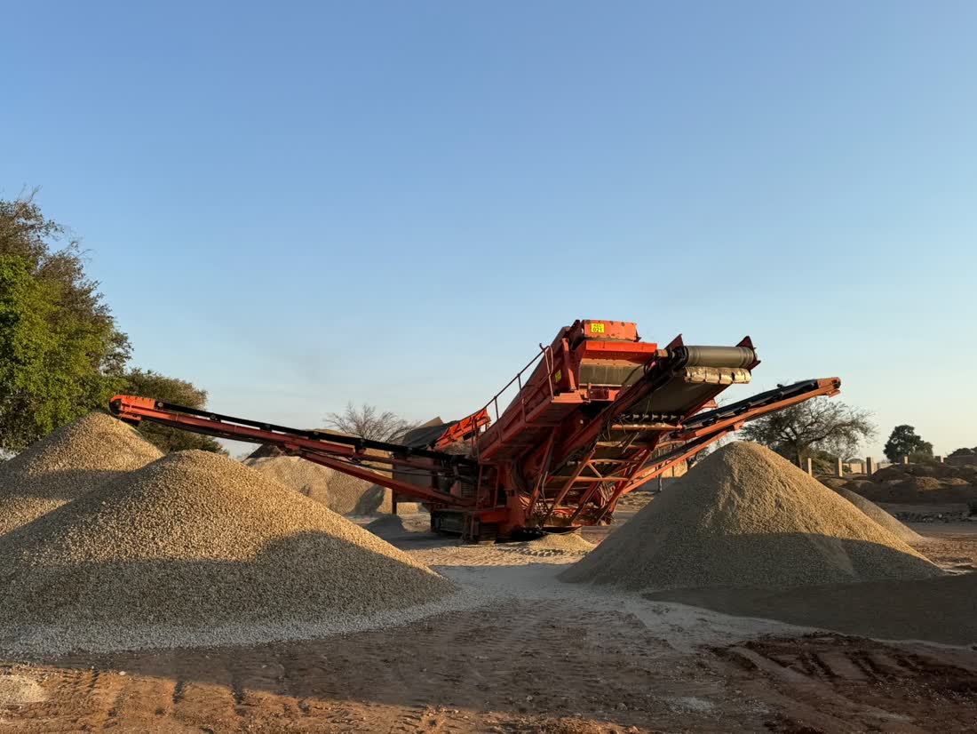 Excavator cutting sand on the Selati riverbed